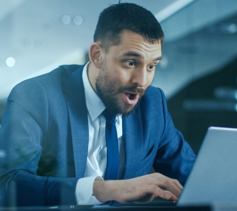 In the Office Businessman Sitting at the Desk Using Laptop Finis
