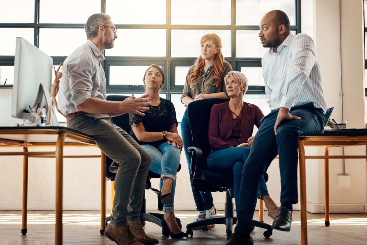 Their collaborative culture keeps them productive. a group of businesspeople having a discussion in a modern office.